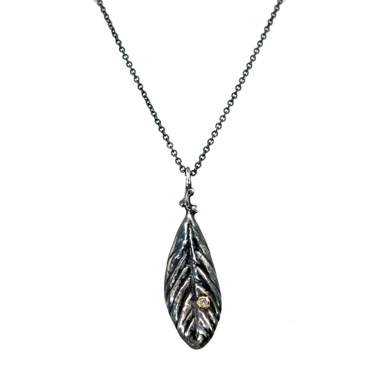 Oxidized Sterling Silver Leaf Pendant with a Tanzanite in 18k Yellow Gold