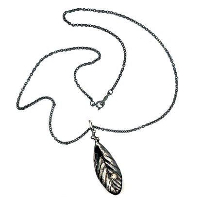 Oxidized Sterling Silver Leaf Pendant with a Tanzanite in 18k Yellow Gold