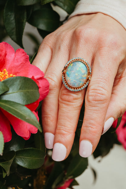 An 18K Rose Gold Australian Opal Ring with Blue and Yellow Diamonds